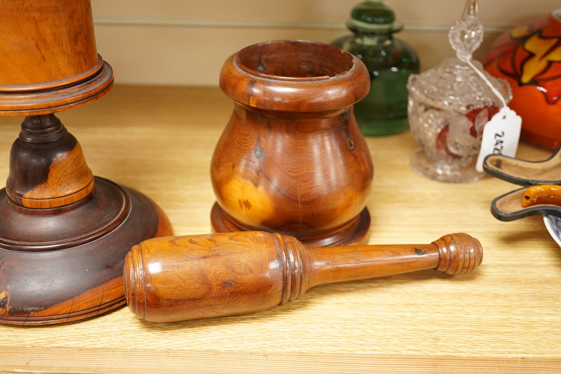A 19th century treen lignum vitae pestle and mortar and turned cup and cover on stand- 25cm high